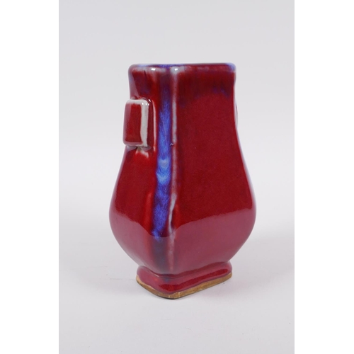 173 - A Chinese flambe glazed porcelain vase with two lug handles, mark to base, 17cm high