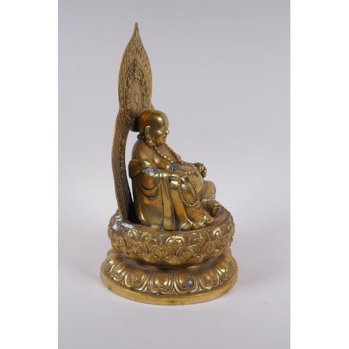 175 - A Chinese gilt bronze figure of Buddha seated on a lotus throne, 4 character mark to base, 29cm high