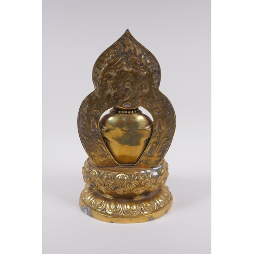 175 - A Chinese gilt bronze figure of Buddha seated on a lotus throne, 4 character mark to base, 29cm high