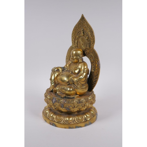 175 - A Chinese gilt bronze figure of Buddha seated on a lotus throne, 4 character mark to base, 29cm high