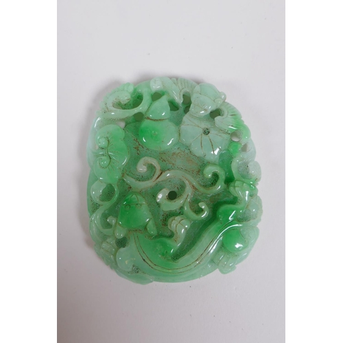 180 - A Chinese carved mottled green jade pendant decorated with flowers, a gourd , kylin and pi disc, 7 x... 