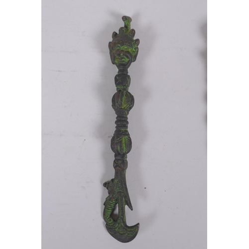 184 - A Tibetan ornamental bronze phurba and a similar kartika, longest 19cm