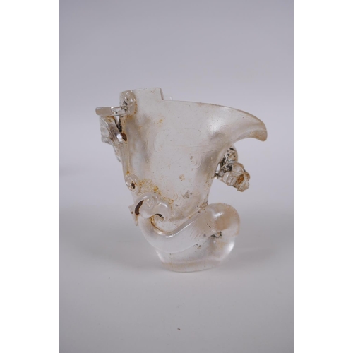 185 - A Chinese glass libation cup with kylin, dragon and phoenix decoration, 9cm high