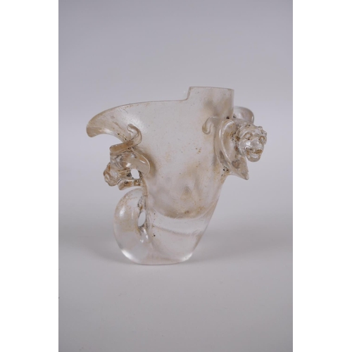 185 - A Chinese glass libation cup with kylin, dragon and phoenix decoration, 9cm high