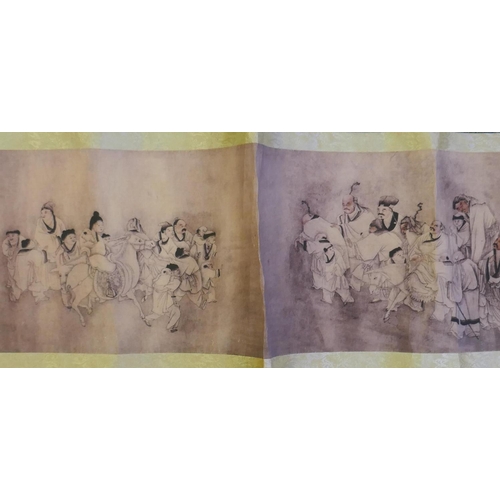 190 - A Chinese printed watercolour scroll depicting figures in a landscape, 220cm x 26cm long