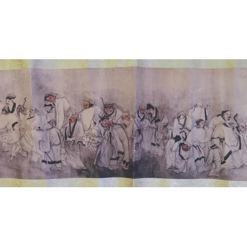 190 - A Chinese printed watercolour scroll depicting figures in a landscape, 220cm x 26cm long