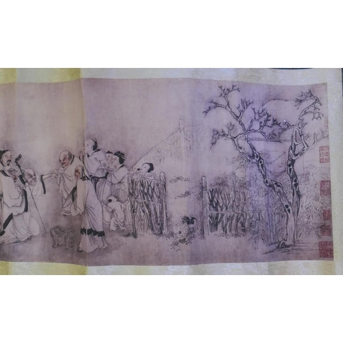 190 - A Chinese printed watercolour scroll depicting figures in a landscape, 220cm x 26cm long