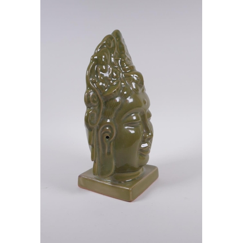 198 - A Chinese olive glazed porcelain headbust of Quan Yin, 26cm high