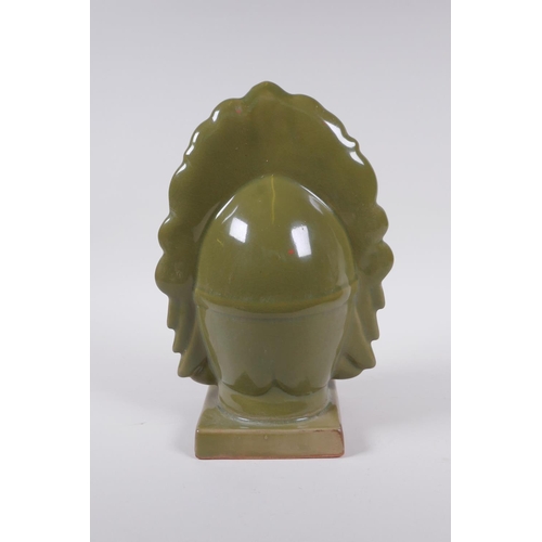 198 - A Chinese olive glazed porcelain headbust of Quan Yin, 26cm high