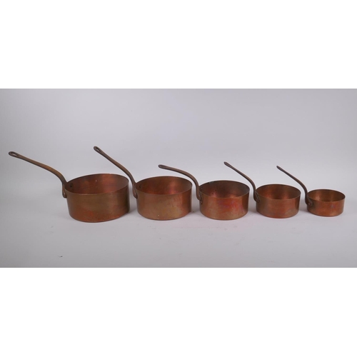 200 - A set of five graduated copper sauce pans, largest 15cm diameter