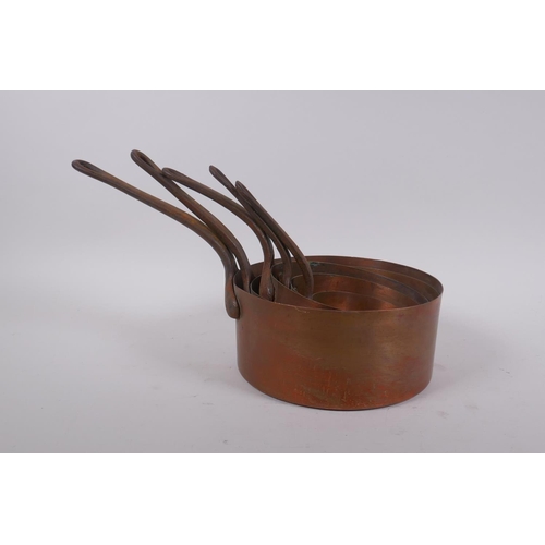 200 - A set of five graduated copper sauce pans, largest 15cm diameter