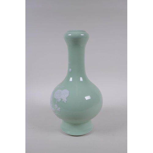 203 - A celadon glazed porcelain garlic head shaped vase with raised white enamel decoration of birds and ... 