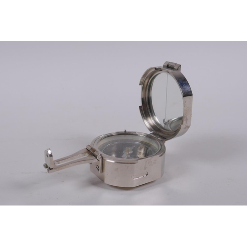 204 - A Brunton style white metal field compass, 6 x 6cm