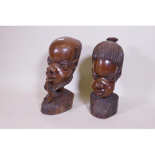 209 - A large pair of African carved hardwood busts, 50cm high