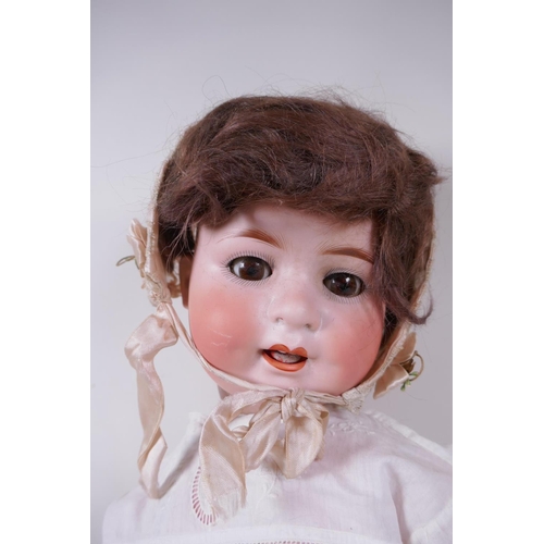 21 - An antique German Heubach Koppelsdorf bisque headed toddler doll with brown sleeping eyes, moving cl... 