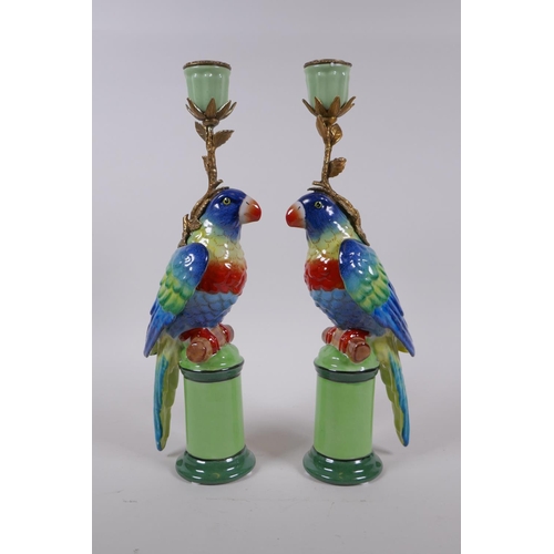 210 - A pair of polychrome porcelain and gilt metal parrot candlesticks, 32cm high