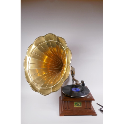 214 - A reproduction HMV gramophone with brass horn, and a collection of 75s, horn 46cm diameter