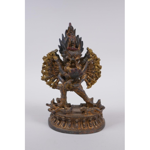 223 - A Tibetan gilt metal figure of Hevajra and Nairatmya, 19cm high