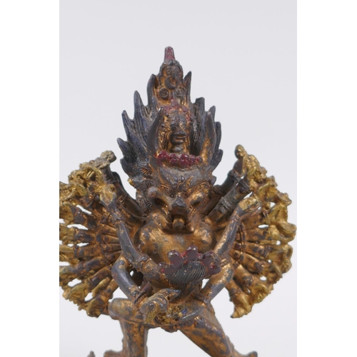 223 - A Tibetan gilt metal figure of Hevajra and Nairatmya, 19cm high