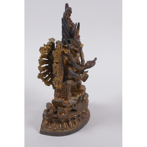 223 - A Tibetan gilt metal figure of Hevajra and Nairatmya, 19cm high