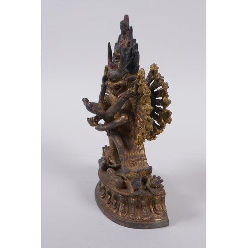 223 - A Tibetan gilt metal figure of Hevajra and Nairatmya, 19cm high