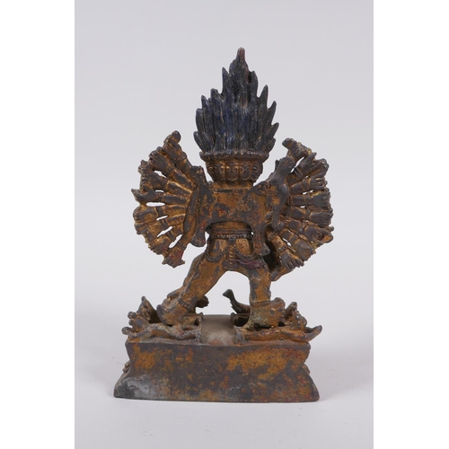 223 - A Tibetan gilt metal figure of Hevajra and Nairatmya, 19cm high