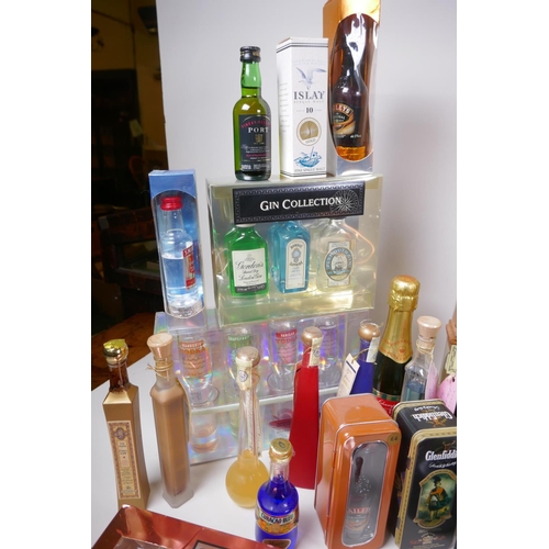 226 - A collection of spirit miniatures, gift sets and singles, including whisky, vodka, brandy, port etc