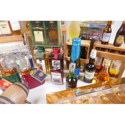 226 - A collection of spirit miniatures, gift sets and singles, including whisky, vodka, brandy, port etc