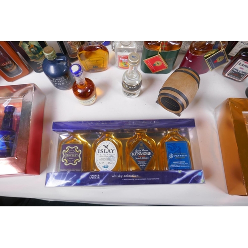 226 - A collection of spirit miniatures, gift sets and singles, including whisky, vodka, brandy, port etc