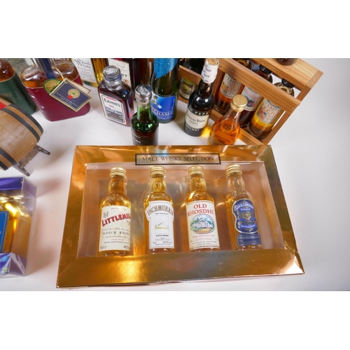 226 - A collection of spirit miniatures, gift sets and singles, including whisky, vodka, brandy, port etc