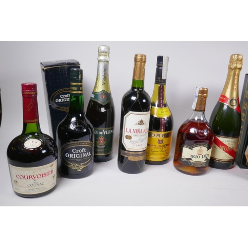 228 - A collection of twelve bottles of spirits and wine, to include G.H. Mumm Champagne, Miguel Torres Ho... 