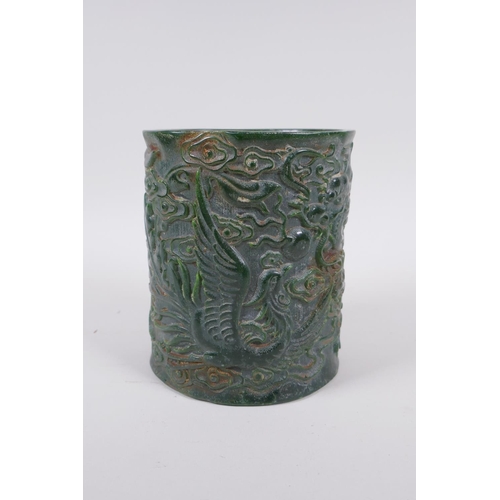 235 - A Chinese carved green hardstone brush pot decorated with a dragon and phoenix, Qianlong seal mark t... 