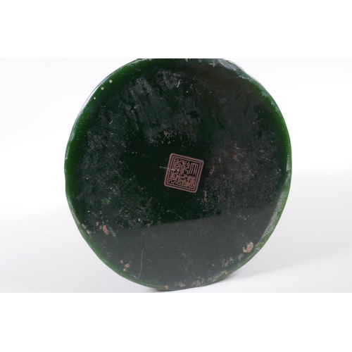 235 - A Chinese carved green hardstone brush pot decorated with a dragon and phoenix, Qianlong seal mark t... 