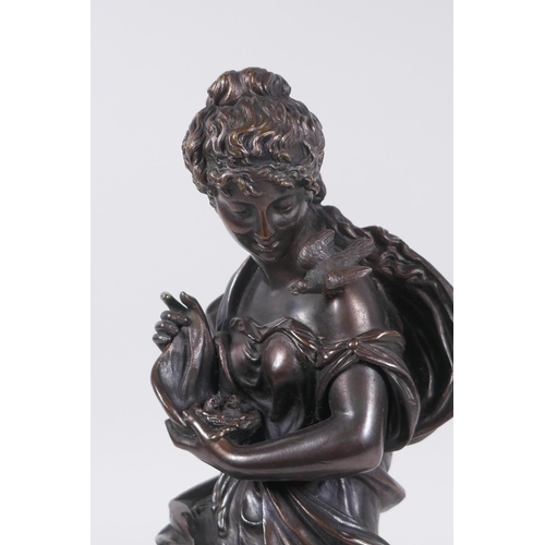 24 - After Emile Bruchon, a late C19th/early C20th French bronze of a seated woman holding a nest of fled... 