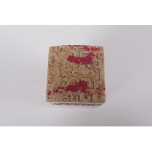 240 - A Chinese reconstituted hardstone seal with dragon decoration, 8 x 8cm, 17cm high