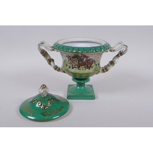 246 - A continental porcelain urn and cover with two handles, decorated with a hunt scene, 20cm high