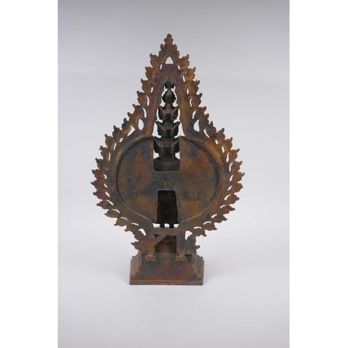 248 - A Tibetan gilt bronze figure of a many armed Buddha, 40cm high