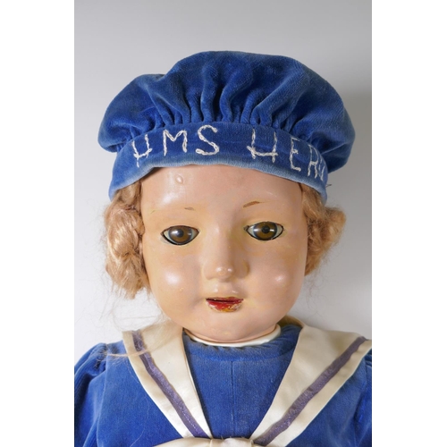 249 - A vintage 30s/40s life size lacquered wood walking doll in 'HMS Hero' clothing, with brown sleeping ... 