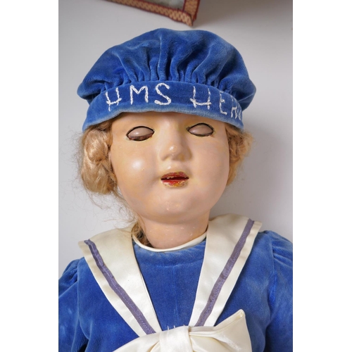 249 - A vintage 30s/40s life size lacquered wood walking doll in 'HMS Hero' clothing, with brown sleeping ... 