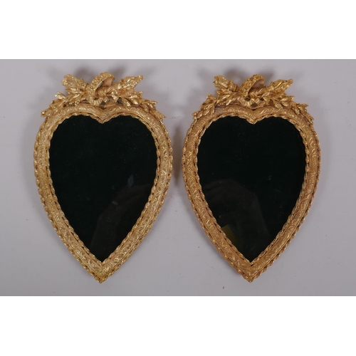 25 - A pair of ormolu heart shaped photograph frames, 13 x 19cm