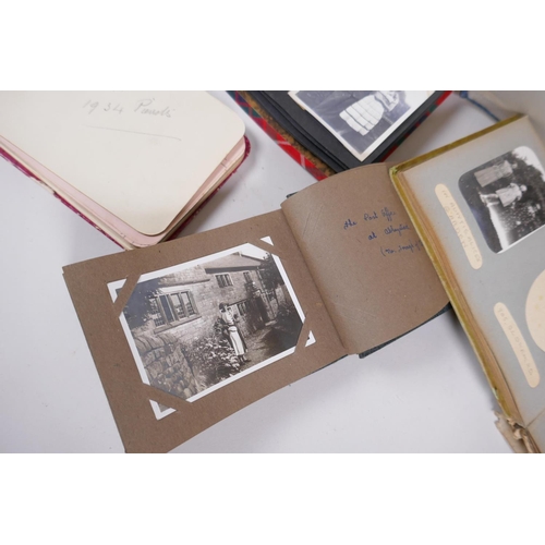 251 - A collection of early C20th photo albums, postcard albums and autograph books, of social historical ... 