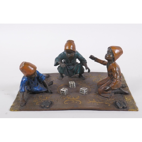 261 - An Austrian style cold painted bronze figure of three Moorish boys playing dice, 20 x 14cm