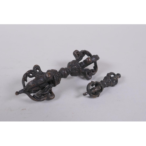 262 - A Tibetan bronze vajra and another smaller, 11cm long