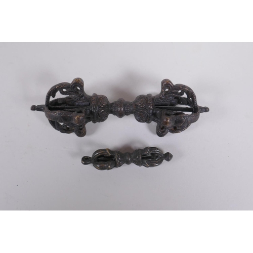 262 - A Tibetan bronze vajra and another smaller, 11cm long