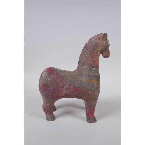 266 - A middle eastern painted terracotta horse, 21cm high