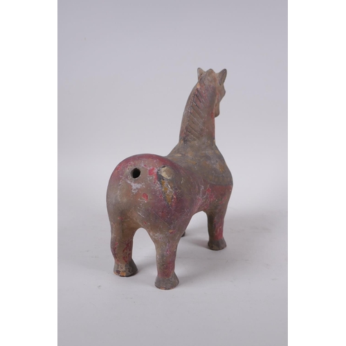 266 - A middle eastern painted terracotta horse, 21cm high