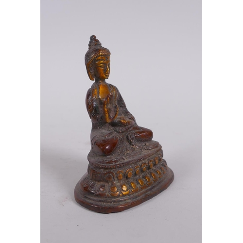 273 - A Sino Tibetan bronze figure of Buddha, and a smaller bronze figure of a female deity, largest 9cm h... 