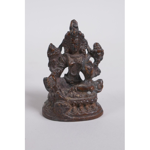 273 - A Sino Tibetan bronze figure of Buddha, and a smaller bronze figure of a female deity, largest 9cm h... 