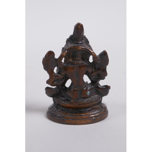 273 - A Sino Tibetan bronze figure of Buddha, and a smaller bronze figure of a female deity, largest 9cm h... 