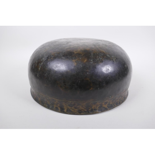 274 - A large Tibetan bronze singing bowl with hammered finish and wood hammer, 13cm high x 28cm diameter